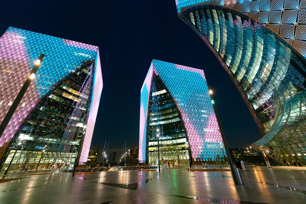 Osool commercial building illuminated at night